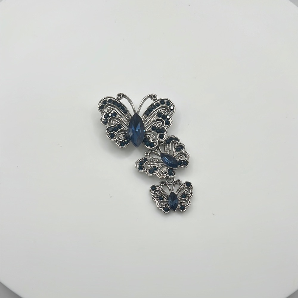506. Elegant Silver Butterfly Broochโ with Blue Accents